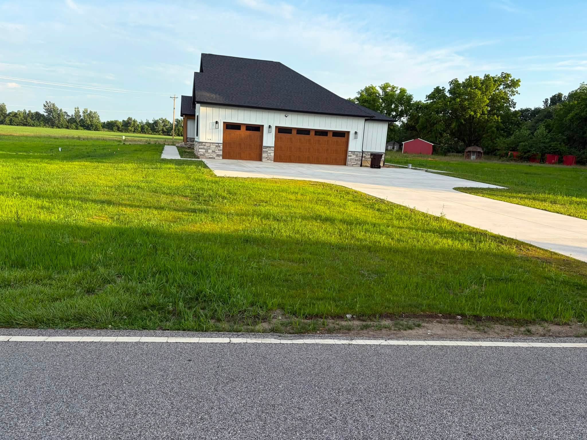 Finished lawn and concrete driveway at a residential property